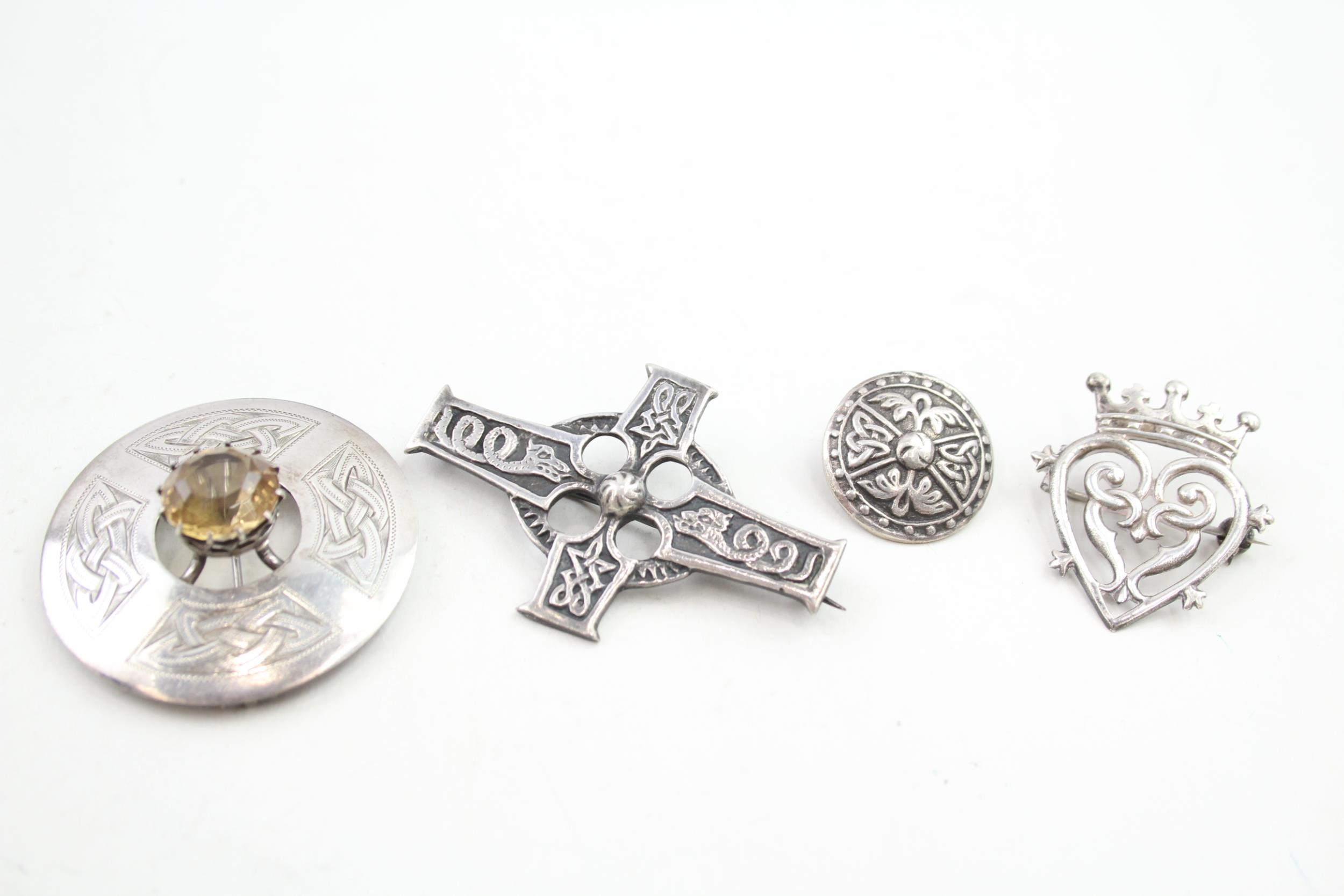 Four Scottish silver brooches including a luckenbooth (32g)