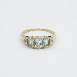 9ct gold aquamarine three stone ring with diamond set heart shoulders Size R 1/2 - 2.5 g