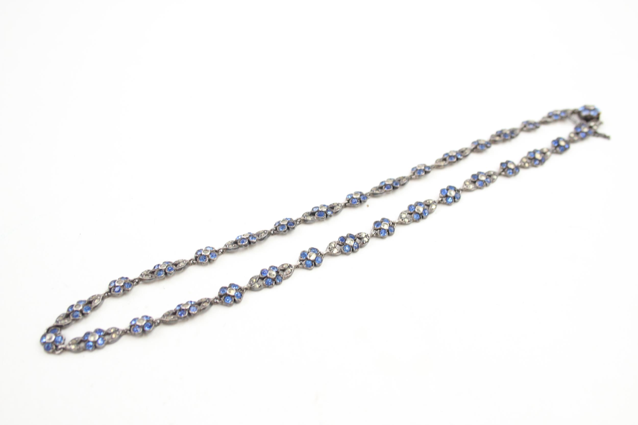 An early 20th century silver marcasite and paste floral necklace (clasp has 9ct tongue) (23g)