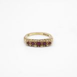 9ct gold vintage ruby five stone ring with a scroll patterned gallery Size O - 3 g