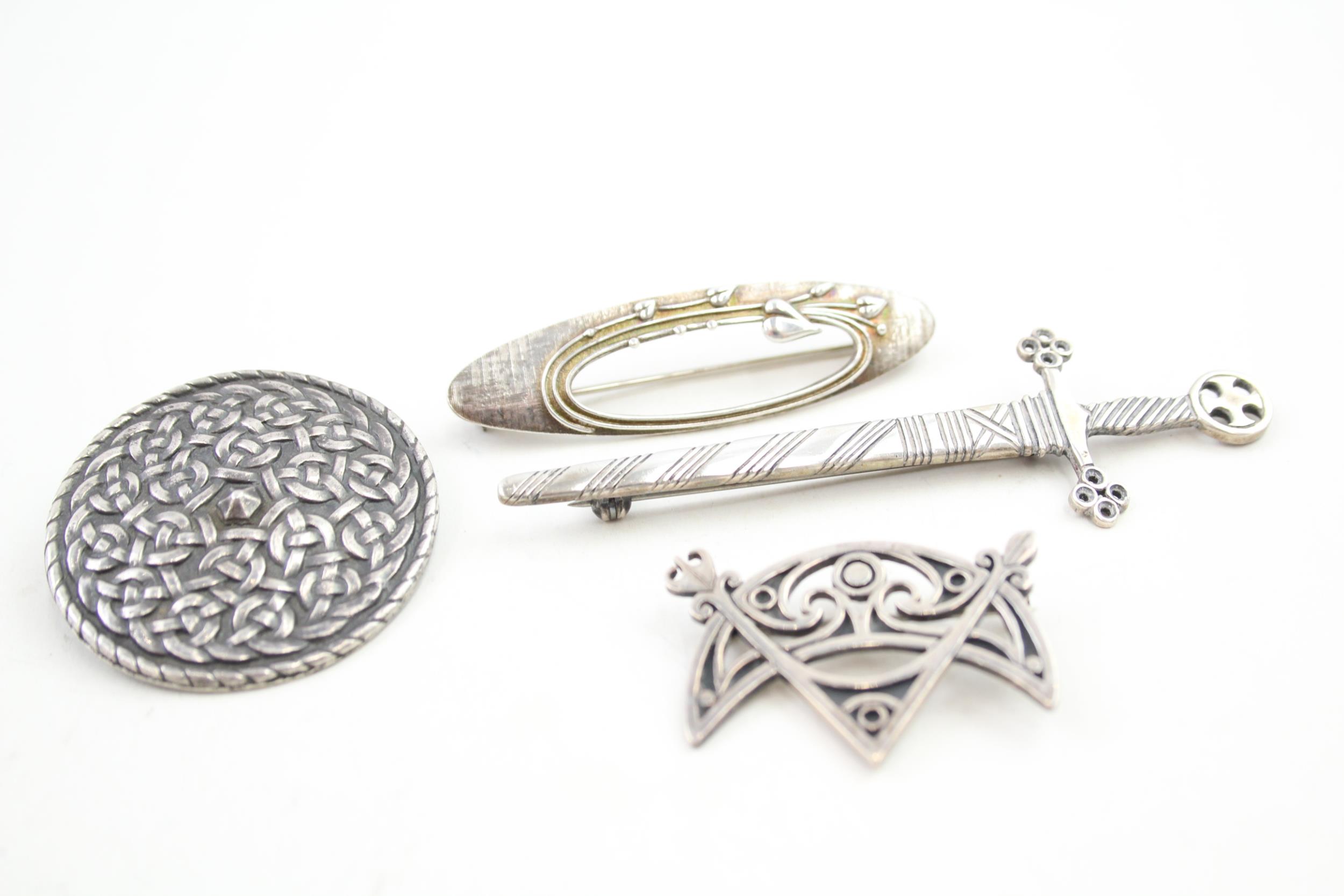 Four Scottish silver brooches including Ola Gorie (33g)