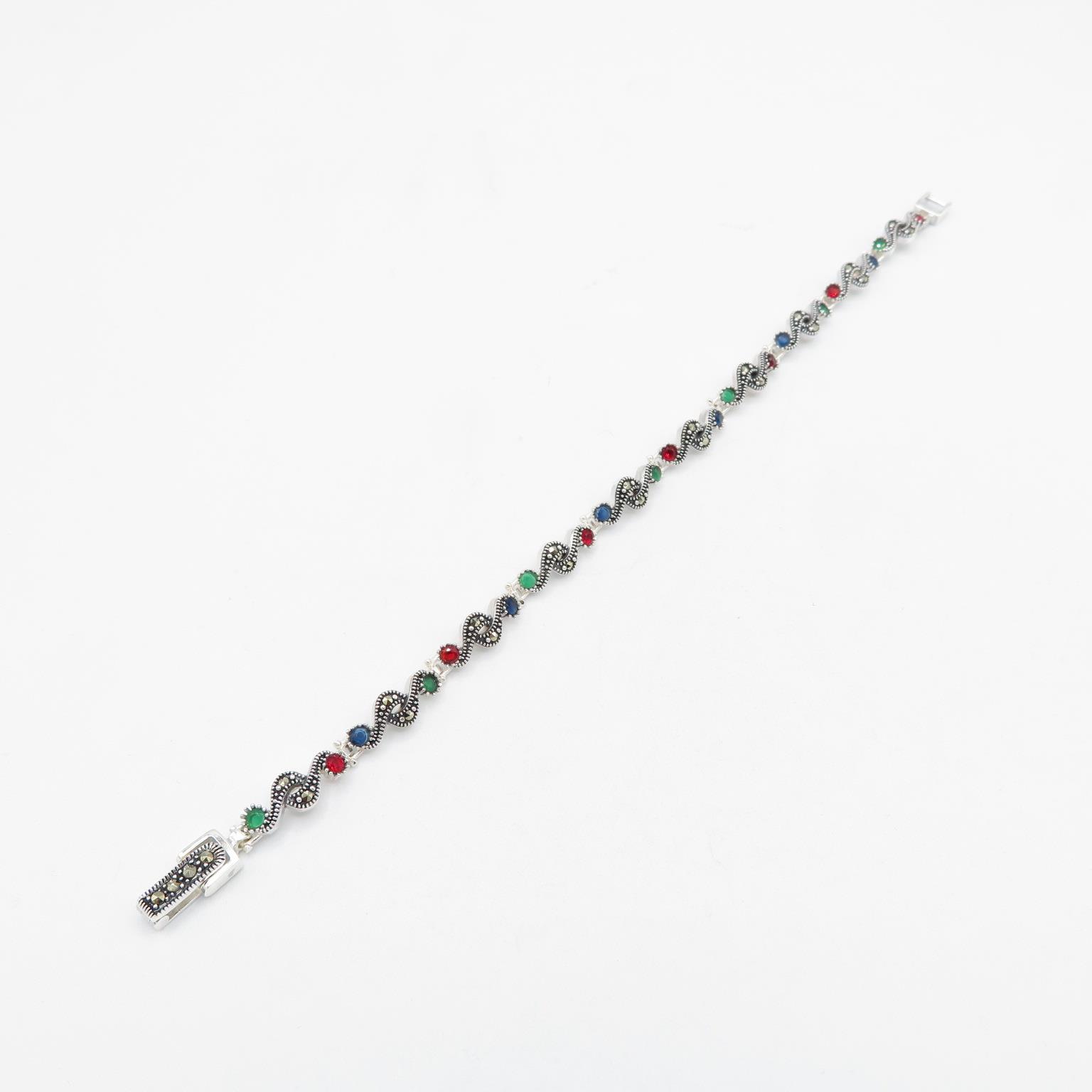 HM 925 Sterling Silver bracelet set with green, blue and red stones (12g) in excellent condition -