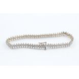 9ct gold diamond link bracelet, claw set (7.7g)