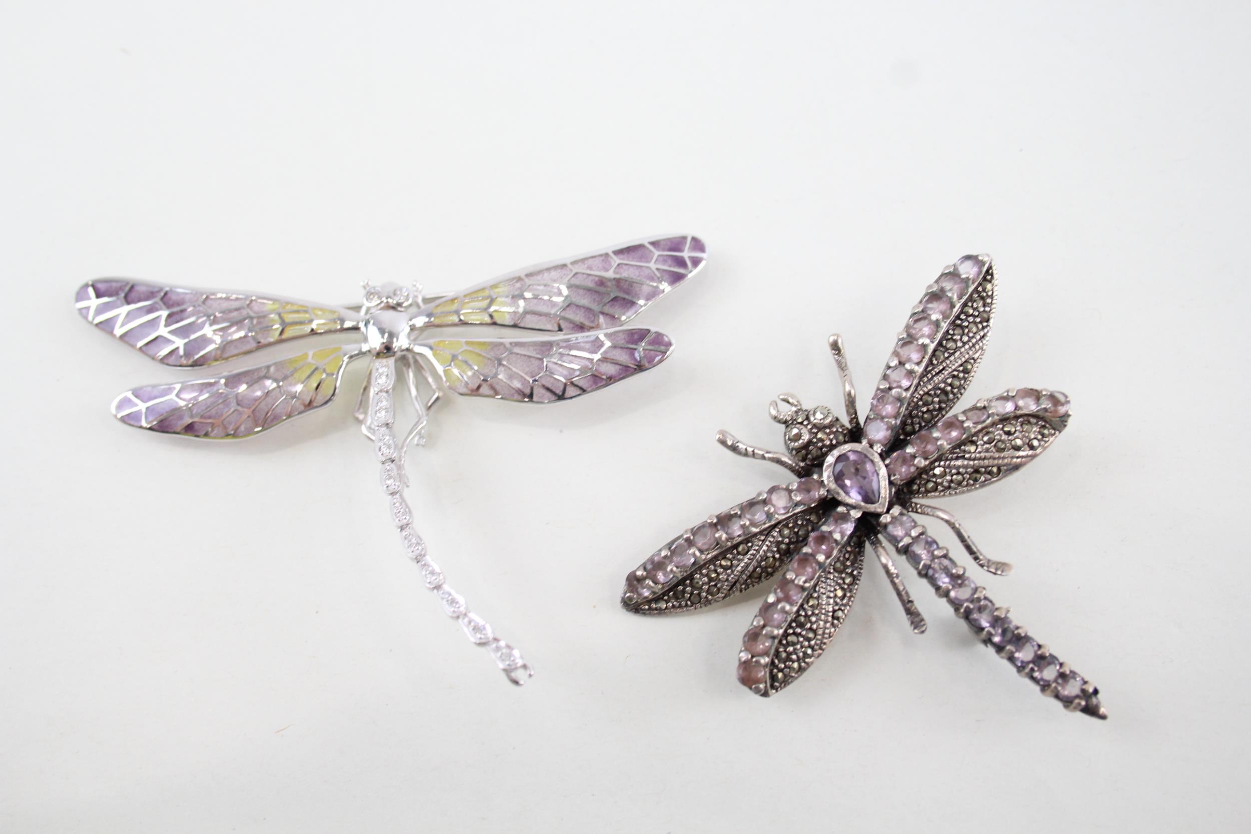 Two sterling silver dragonfly brooches including marcasite, amethyst (34g)
