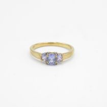 9ct gold oval cut tanzanite & diamond three stone ring, claw set (2g) Size P