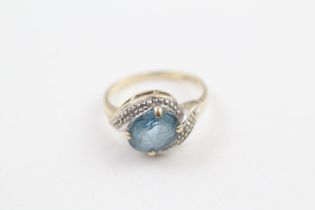 9ct gold oval cut blue topaz & diamond dress ring (2.1g) Size J