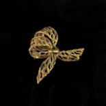 Bow brooch, 585/14K yellow gold (hallmarked), 7.65g, open work, dimensions approx. 3.6x4.5cm *951/1