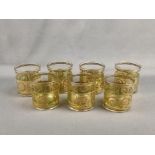 Seven drinking glasses, colourless glass, matt green band, ornamental gold rims and gold painting,