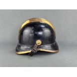 Fire brigade helmet, probably from southern Germany around 1920, covered with black leather