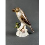 Porcelain figurine "Sparrow" Meissen sword mark, sparrow sitting on a branch base, with leaves, und