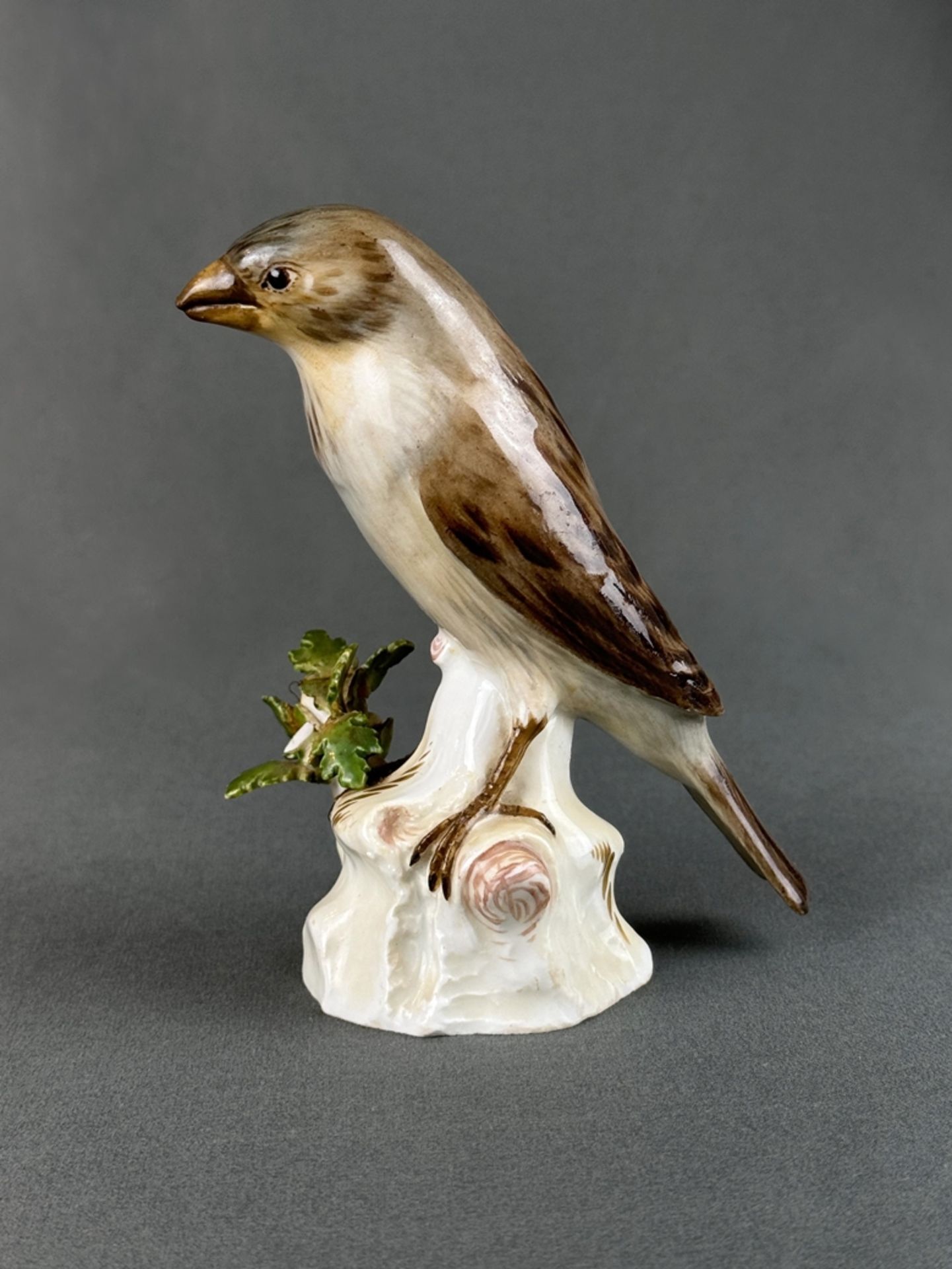 Porcelain figurine "Sparrow" Meissen sword mark, sparrow sitting on a branch base, with leaves, und