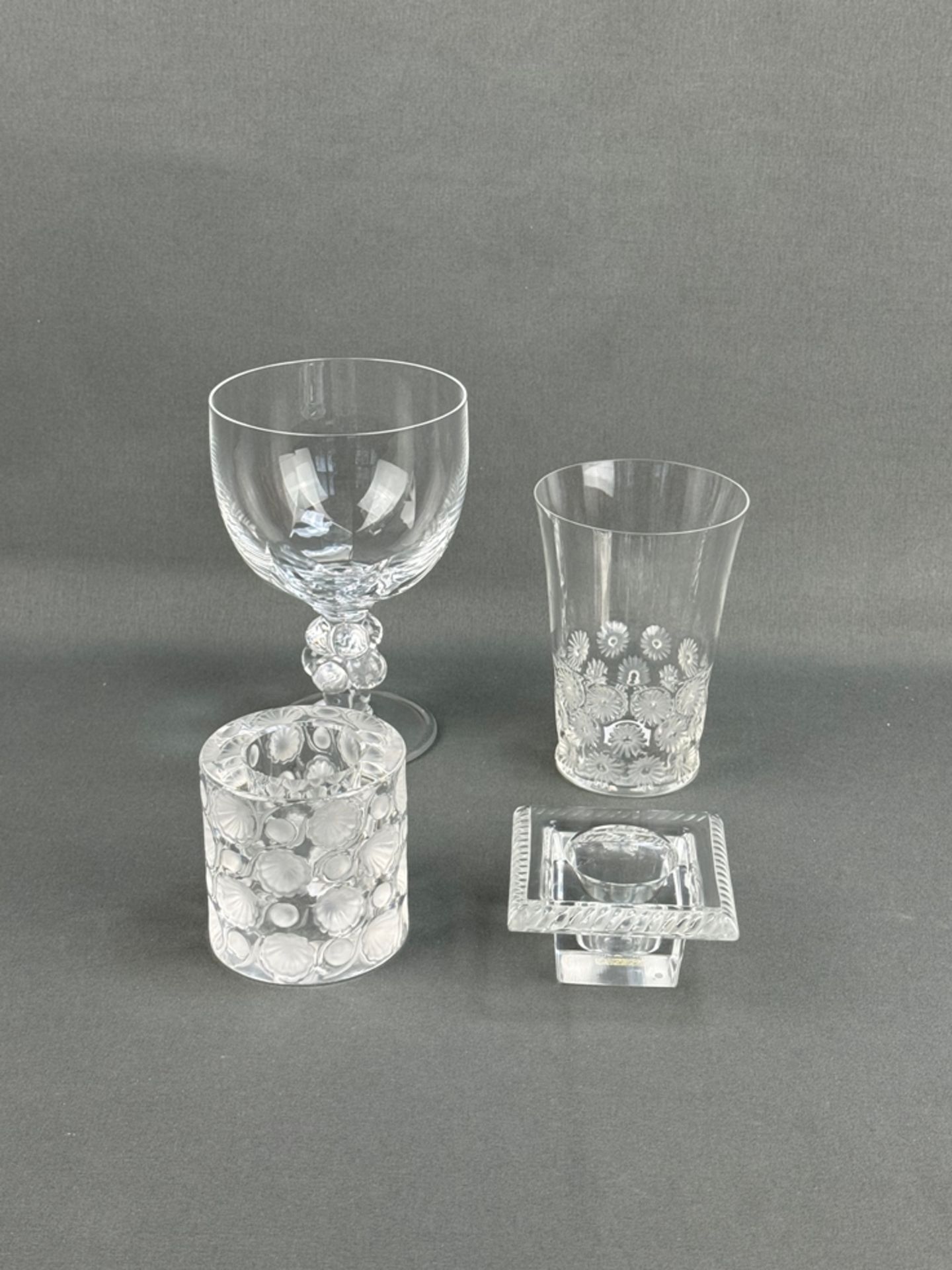 Four pieces, Lalique, colourless glass, all signed on the base, consisting of: fine goblet, stem de