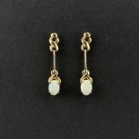 Pair of opal stud earrings, 750/18K yellow gold (hallmarked), 3.6g, each with suspended movable ele