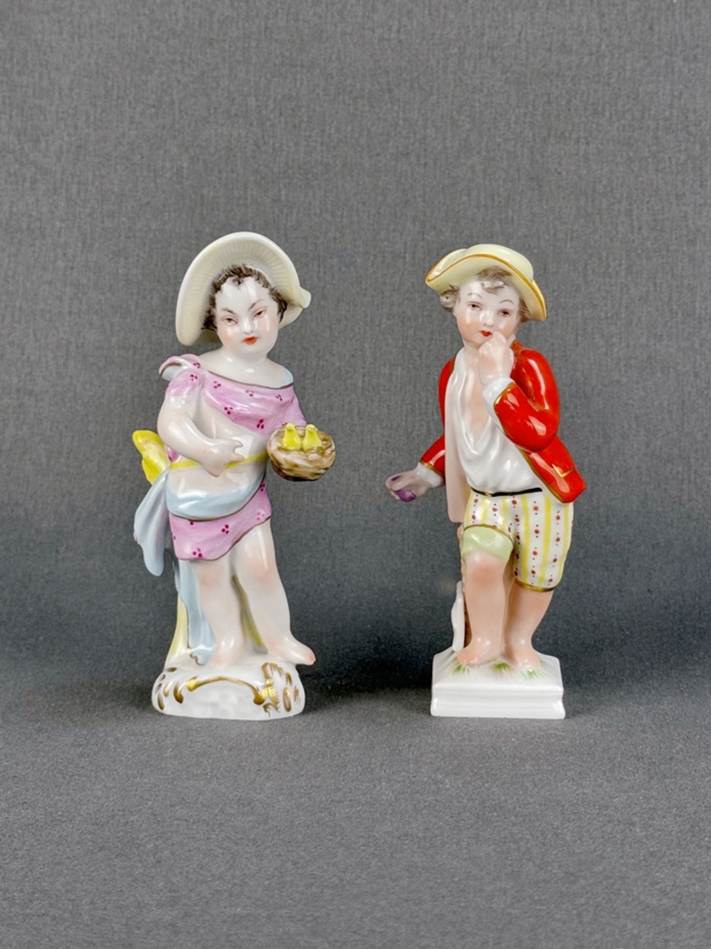 Pair of porcelain figurines, KPM Berlin, each finely polychrome painted, blue sceptre mark and red
