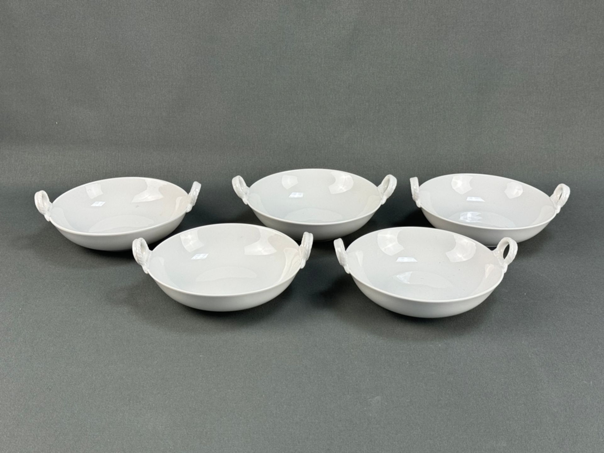 Five small bowls with handles, KPM Berlin, white porcelain, blue sceptre mark on the base, two open