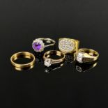 A collection of five rings, one ring with large zirconia, 333/8K yellow gold, 3.27g, ring size 58, 