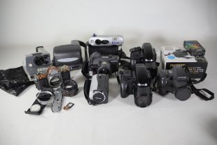 Job Lot Video Cameras And A Camera Lens plus some polaroid style cameras
