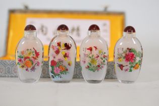 A Cased Set Of Four 20th Century Chinese Reverse Painted Scent Bottles, Each Decorated With Butterf