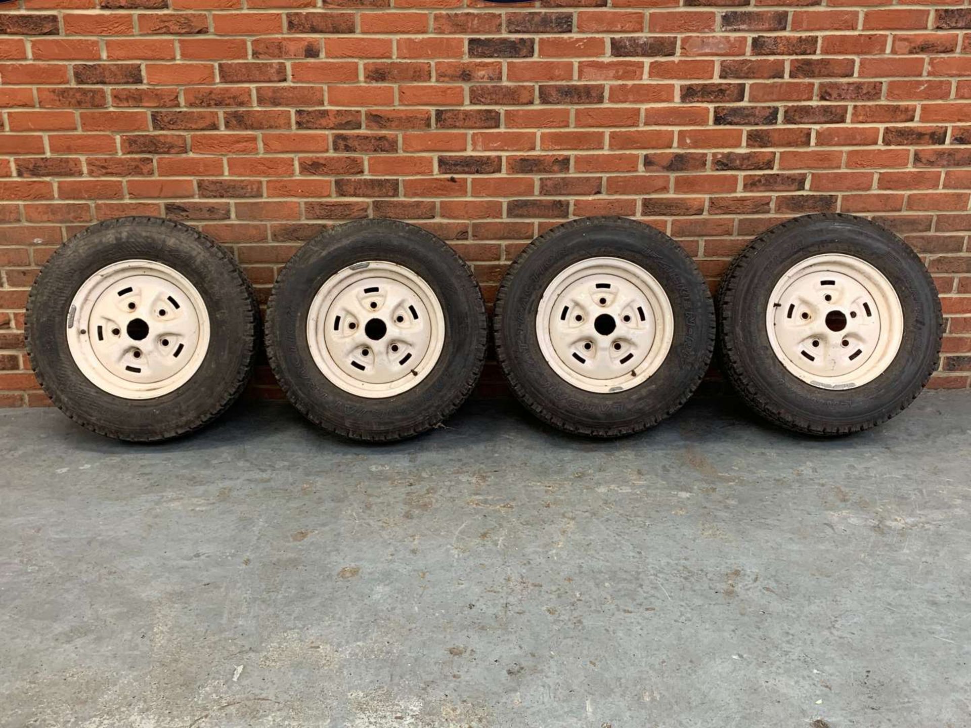 Set of Four Steel Rimmed Land Rover Wheels