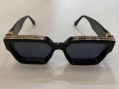 LOUIS VUITTON, a pair of Italian gilt highlighted, black framed sunglasses