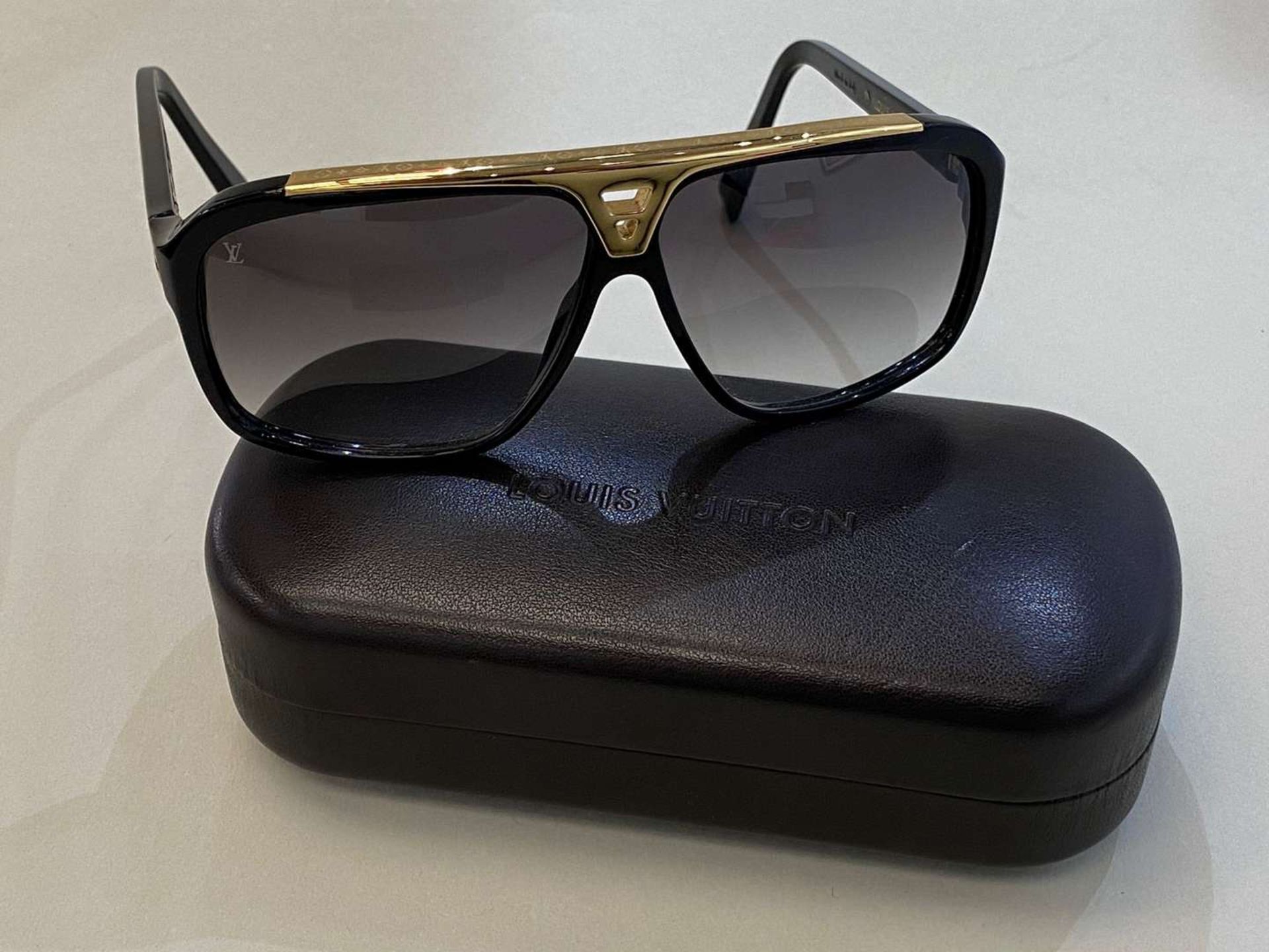 LOUIS VUITTON, a pair of Italian, gilt mounted, black framed sunglasses