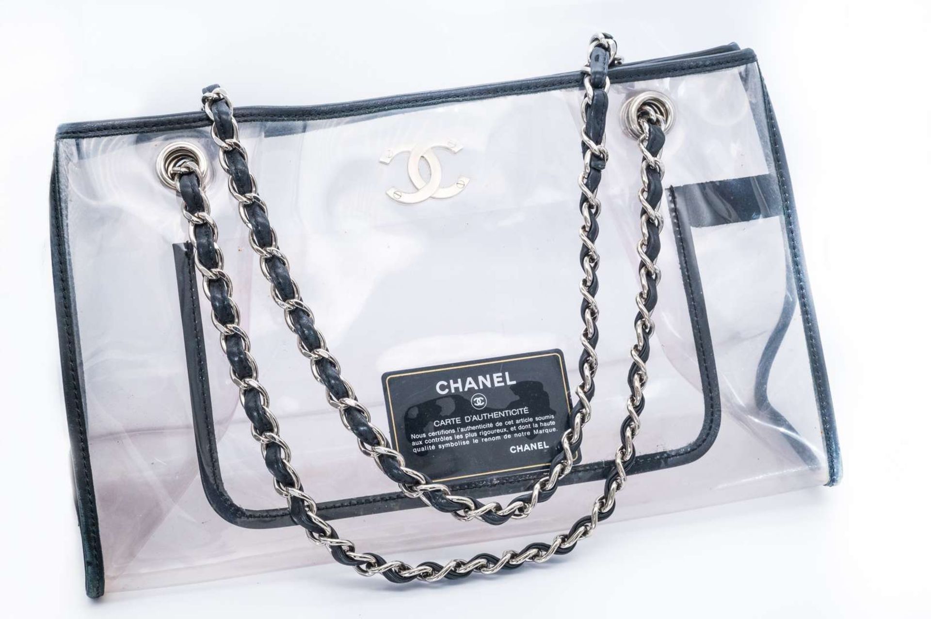 CHANEL, PVC tote bag, with black leather trim and silver curb link chain carry strap. 2006-2008 - Bild 2 aus 4