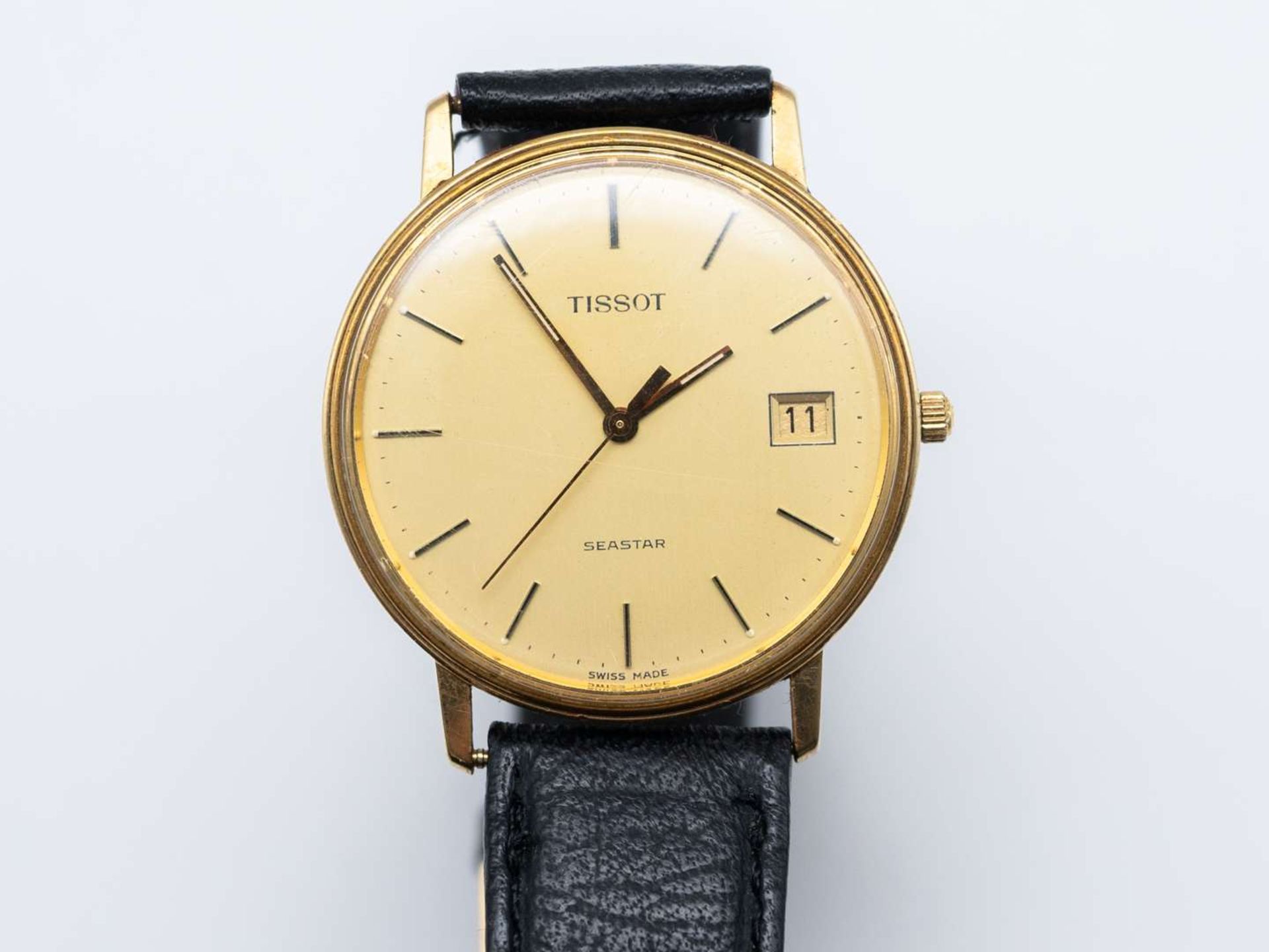 TISSOT, SEASTAR, &nbsp;a modern 9 ct gold, centre seconds, calendar wristwatch.