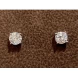 A Pair of Diamond stud earrings