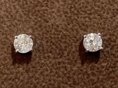 A Pair of Diamond stud earrings