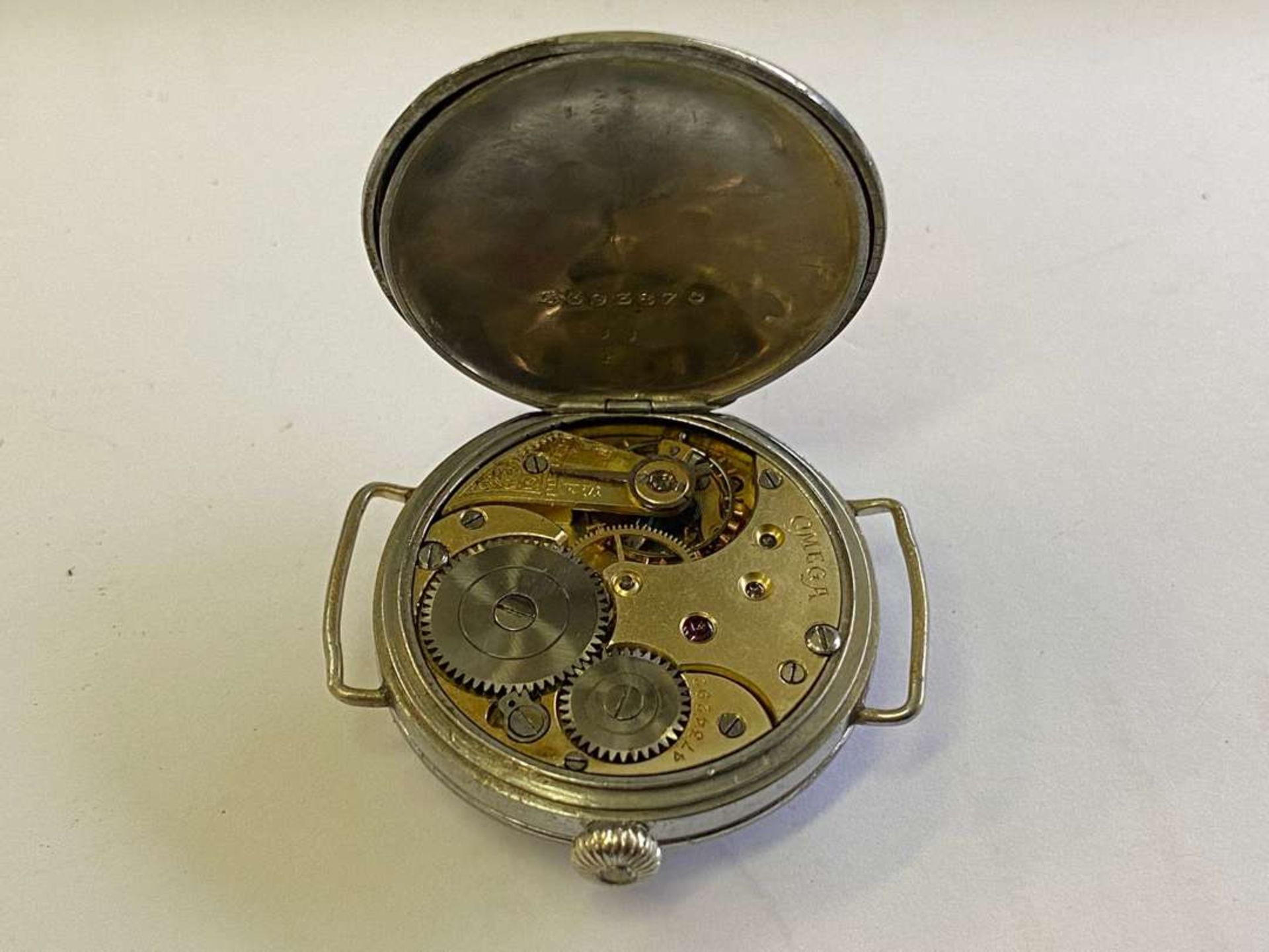 OMEGA. an early 20th century base metal cased wristwatch. - Image 5 of 7