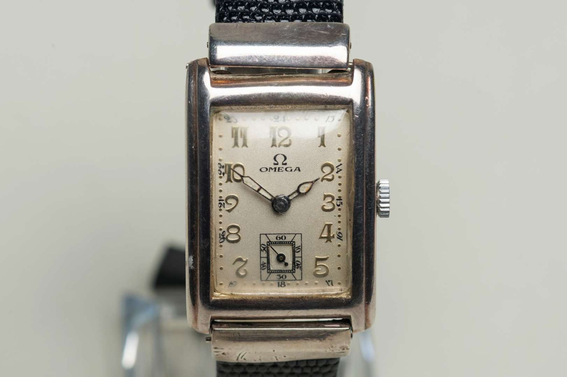 OMEGA. a first half of the 20th century, rectangular silver cased wristwatch,