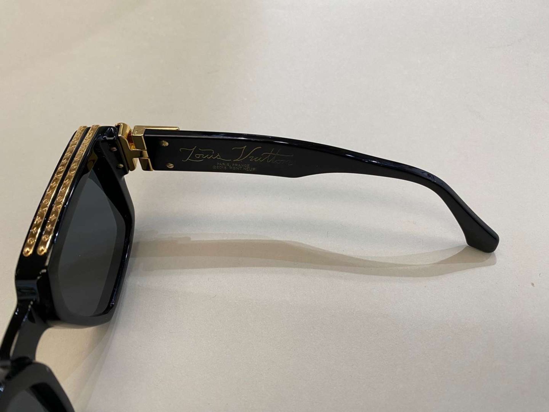 LOUIS VUITTON, a pair of Italian gilt highlighted, black framed sunglasses - Image 2 of 4