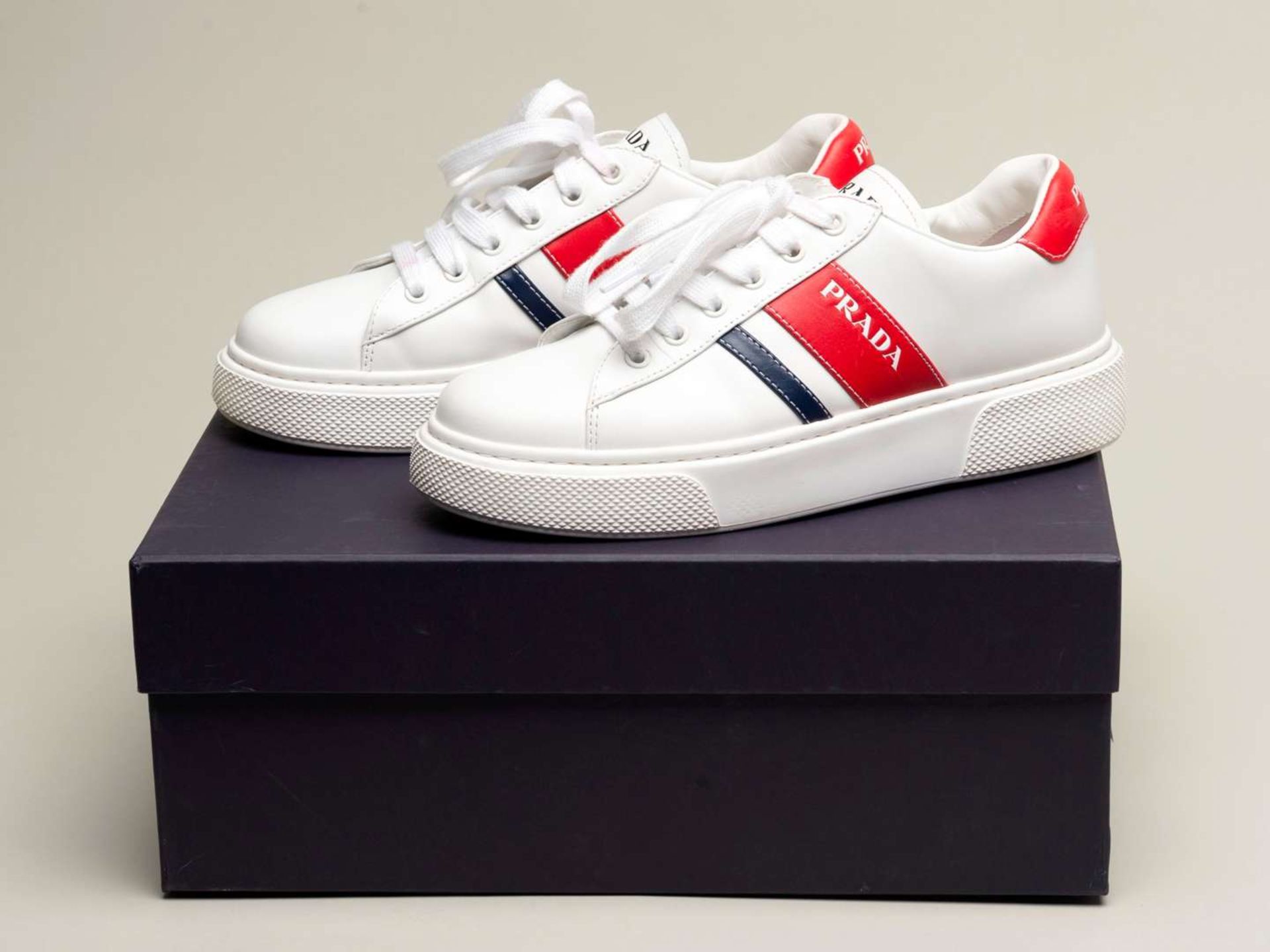 PRADA, a pair of Bianco+ Rosso, Vitello Soft sneakers