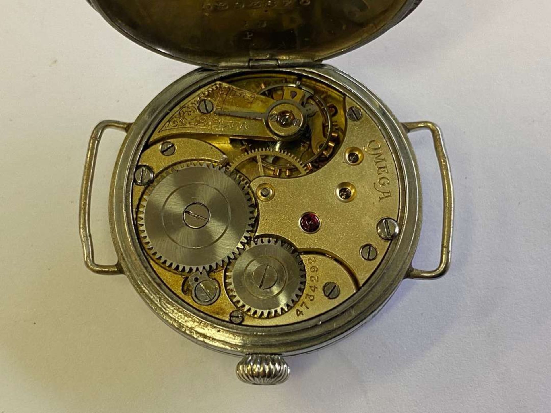 OMEGA. an early 20th century base metal cased wristwatch. - Image 7 of 7
