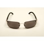 CARTIER, a &nbsp;pair of French rimless, horn armed sunglasses