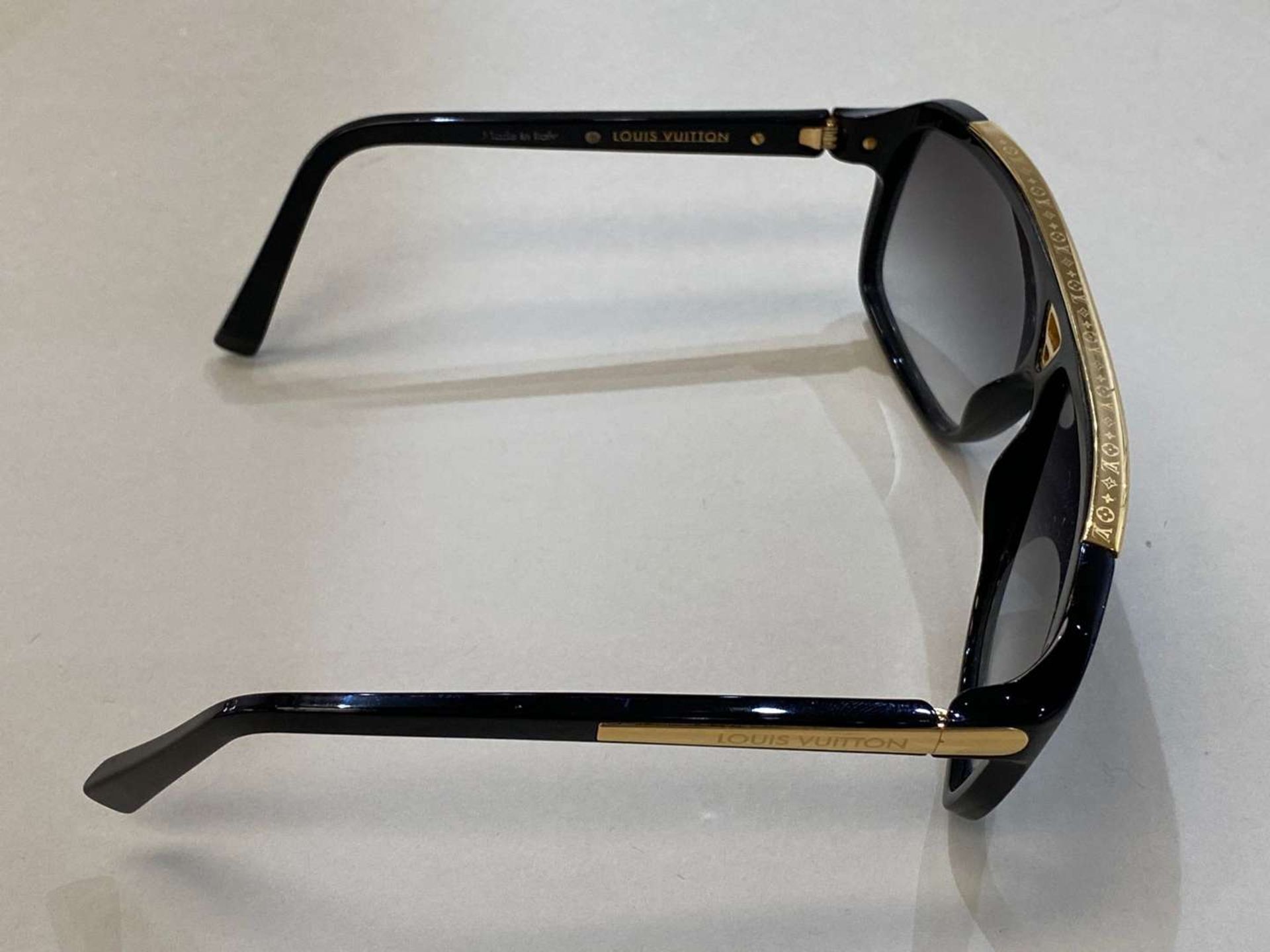 LOUIS VUITTON, a pair of Italian, gilt mounted, black framed sunglasses - Image 2 of 3