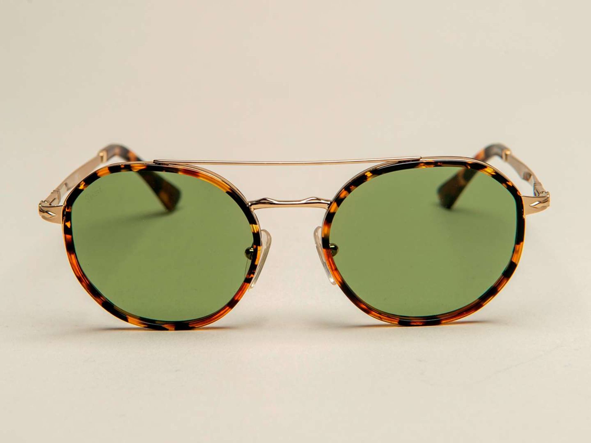 PERSOL, a pair of Italian gilt and tortoiseshell sunglasses