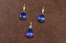 A pair of modern Tanzanite earrings and matching pendant set,