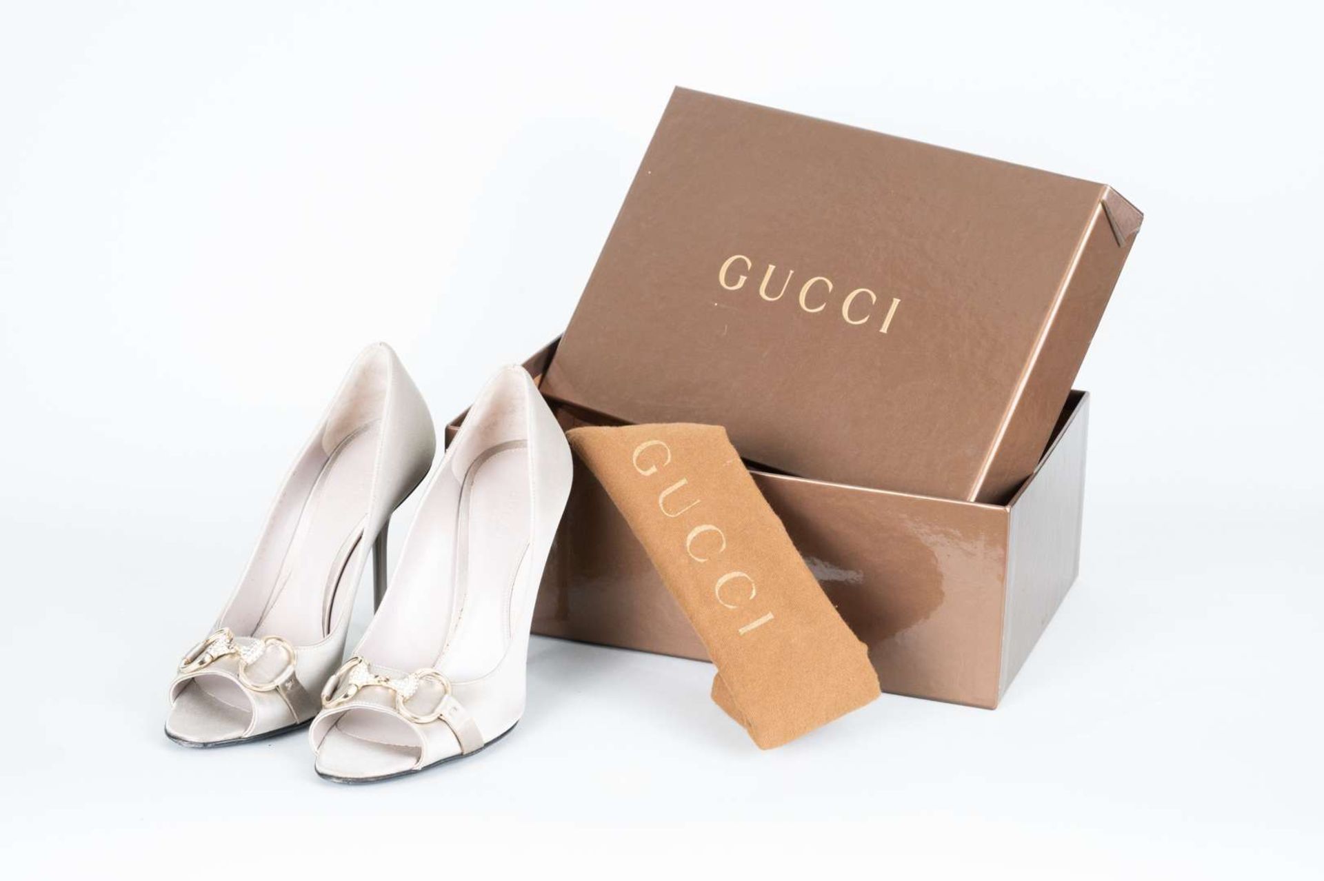 GUCCI, a pair of satin pumps with jewelled and gilt bridle buckle