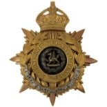 A KING'S CROWN SOUTH WALES BORDERERS BLUE CLOTH HELMET PLATE,