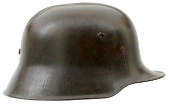 AN IMPERIAL GERMAN MODEL 1916 MACHINE GUNNER'S STEEL HELMET,