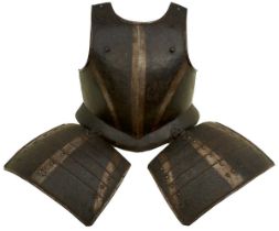 A LATE 16TH CENTURY GERMAN BLACK AND WHITE BREAST PLATE AND TASSET ENSEMBLE,