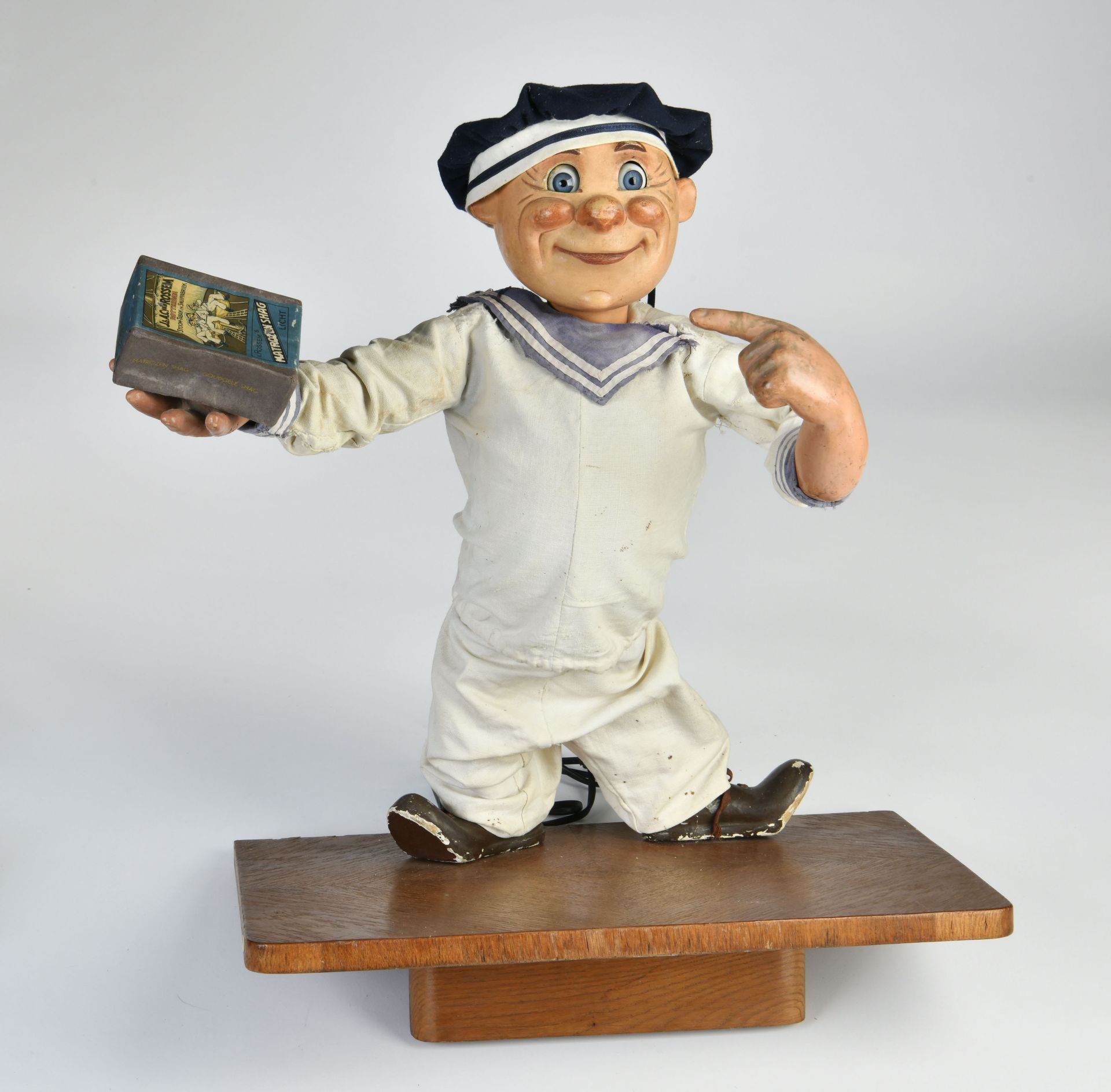 Advertising automaton "sailor", bobblehead with limber eyes on pedestal, electric drive ok, traces