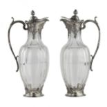 A pair of glass Regency style jugs in silver from CHRISTOFLE.