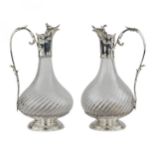 Pair of French, spiral glass wine jugs with silver. Late 19th century.