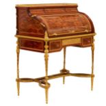 E.KAHN. A magnificent cylindrical bureau in mahogany and satin wood with gilt bronze.