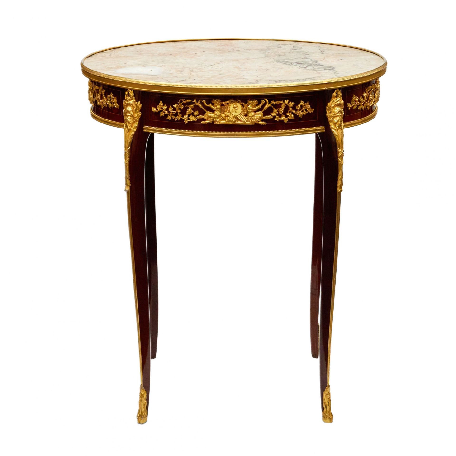 Magnificent mahogany and gilded bronze table by Francois Linke.