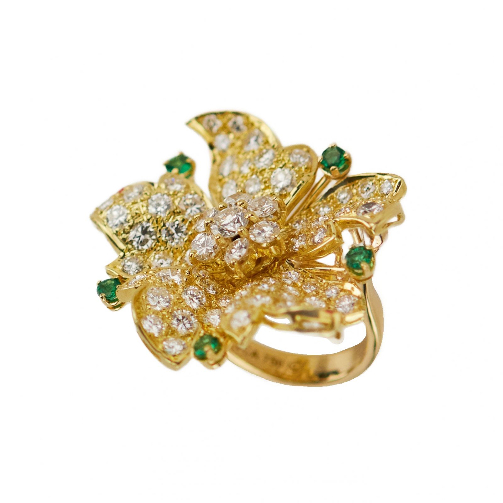 Gold 18K ring with seventy-seven diamonds and five emeralds.