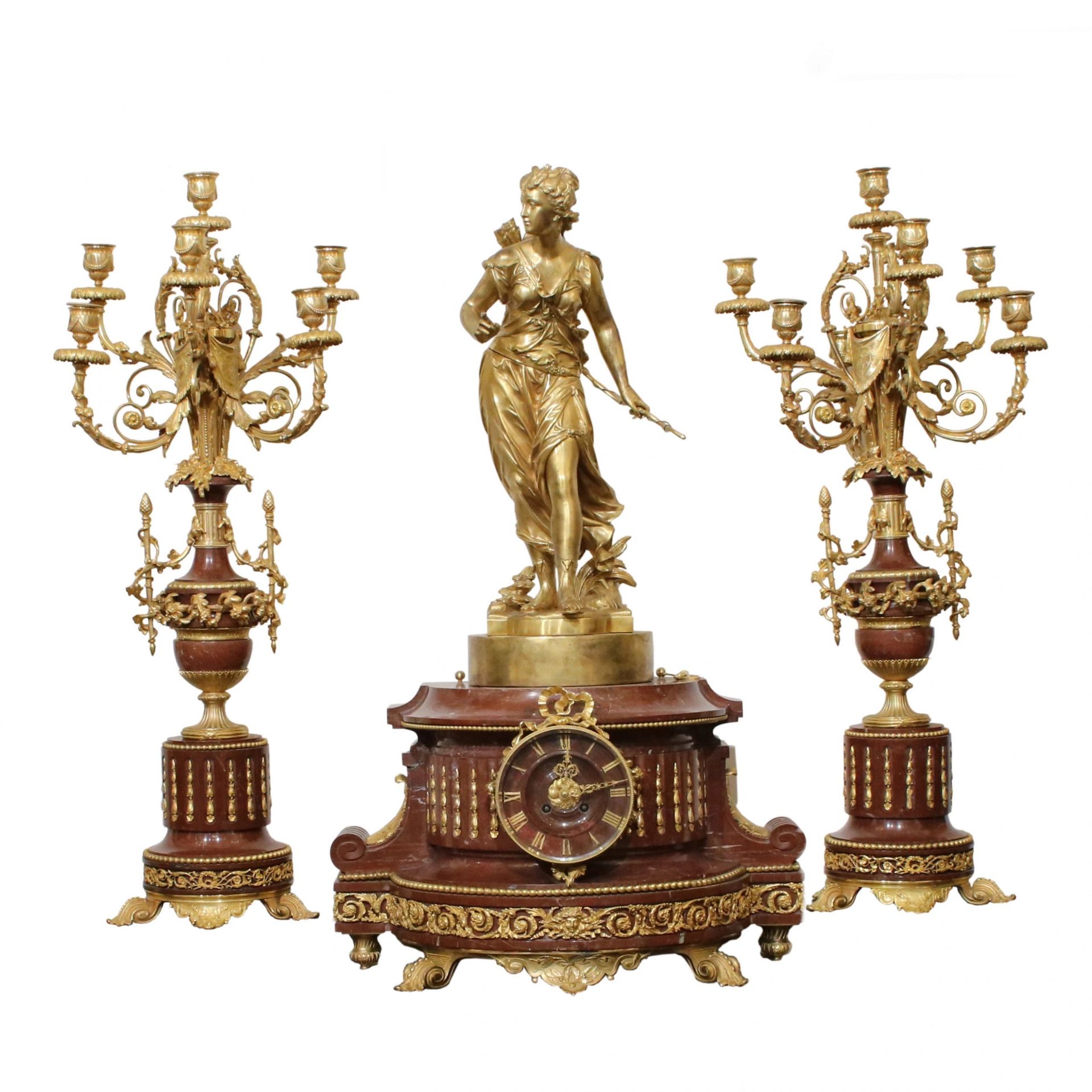 Bronze fireplace clock set with candelabra.