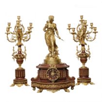 Bronze fireplace clock set with candelabra.